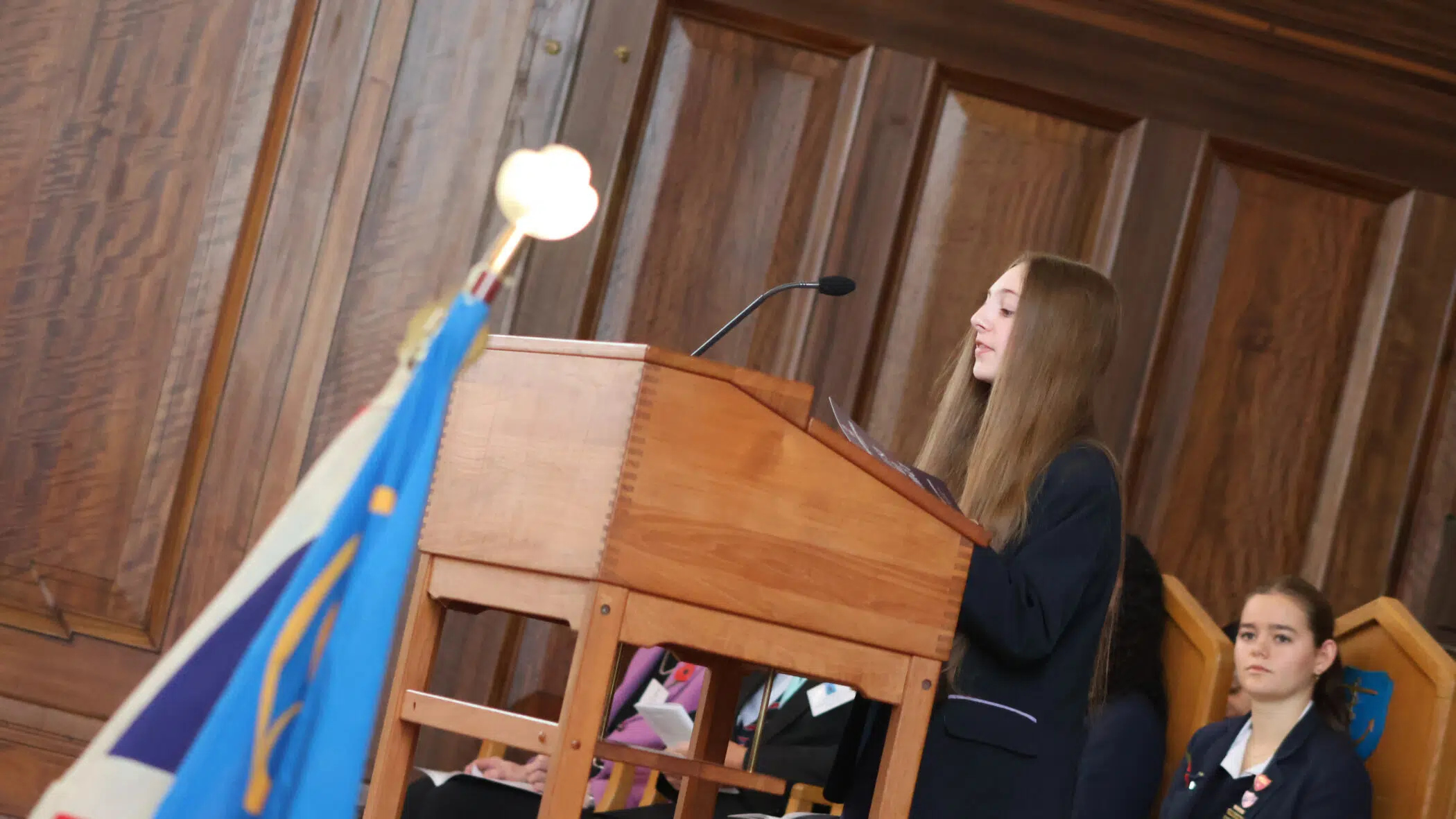 student reading into a microphone