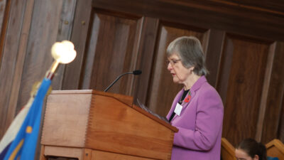 lady giving a speech at a podium