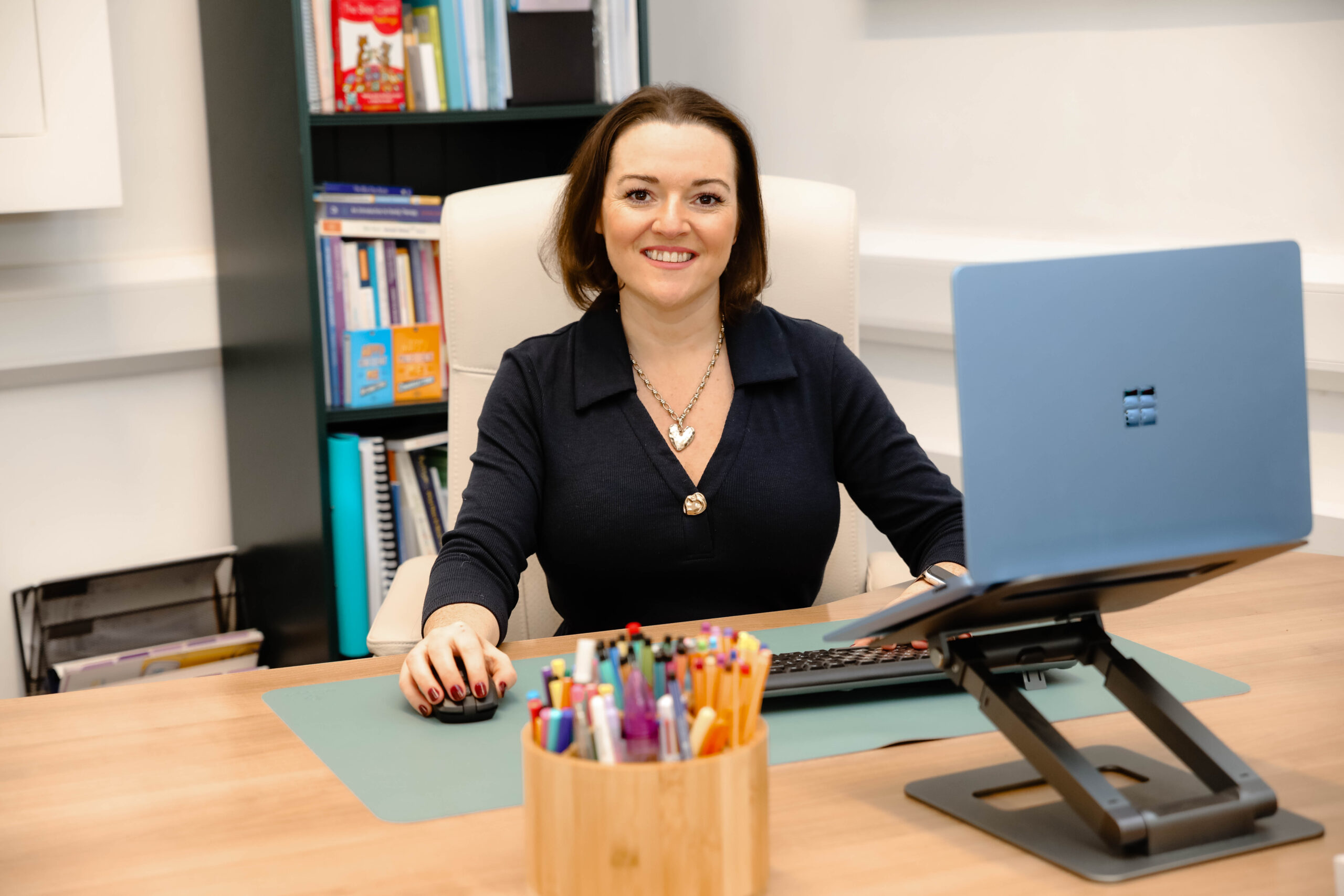 woman sat at her desk